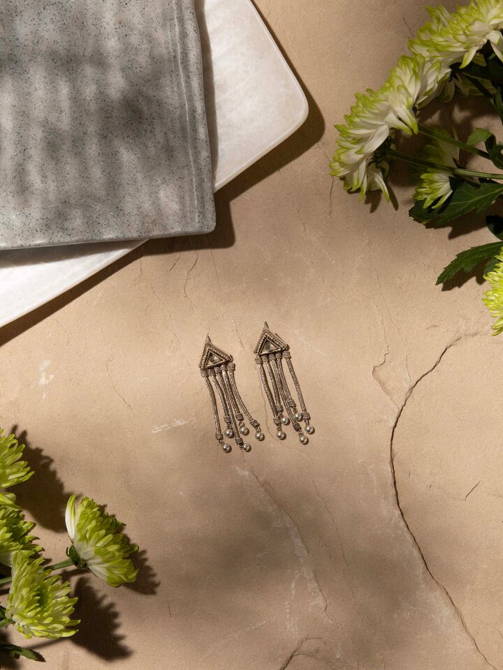 Angled view of Silver Drop Earrings showcasing their stylish design and elegant appearance.