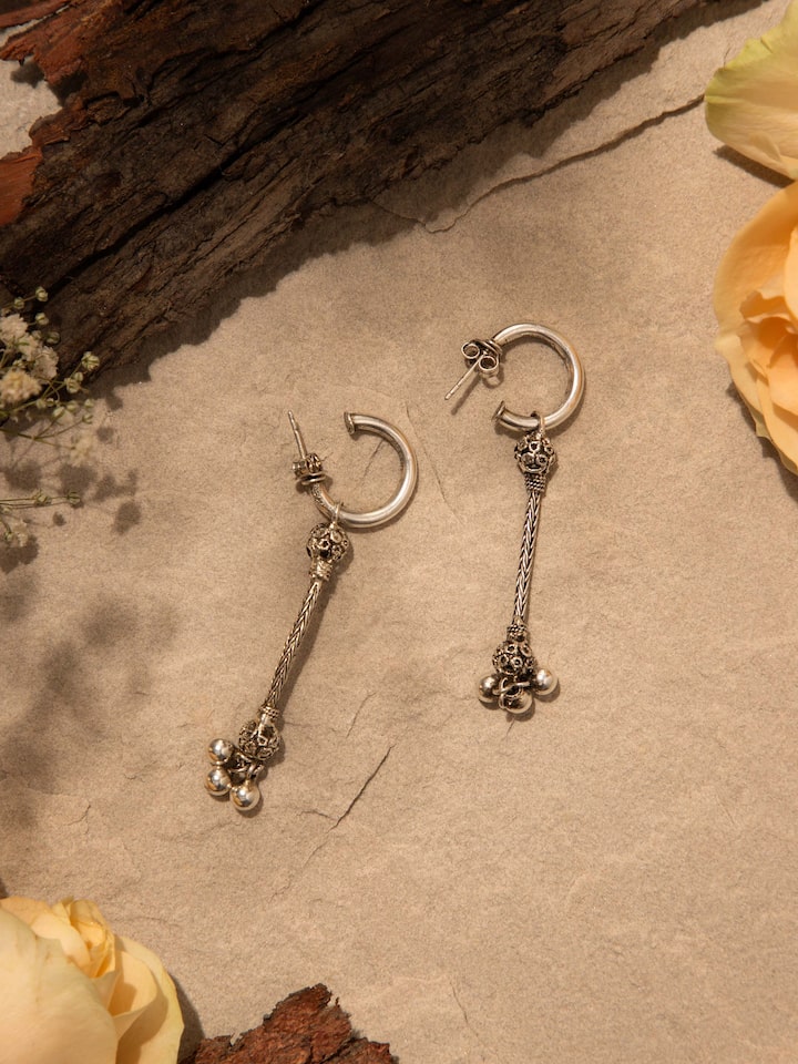 Side view of Silver Drop Earrings highlighting the earring's drop design and overall length