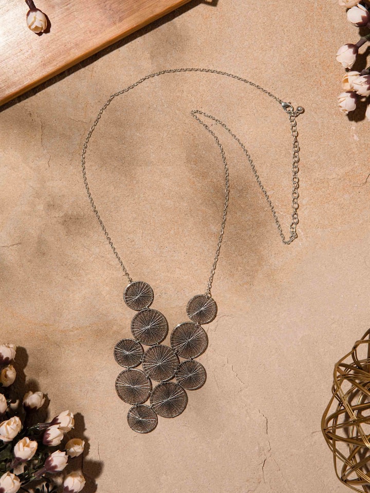 Side view of String Craft Long Necklace illustrating the length and unique string design.