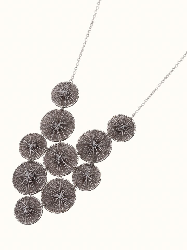 Angled view of String Craft Long Necklace highlighting the creative string arrangement and length.