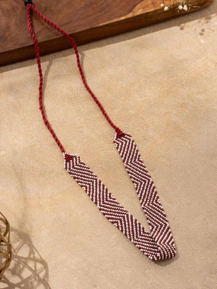 Close-up view of handcrafted long necklace showcasing fine details and artisanal design.
