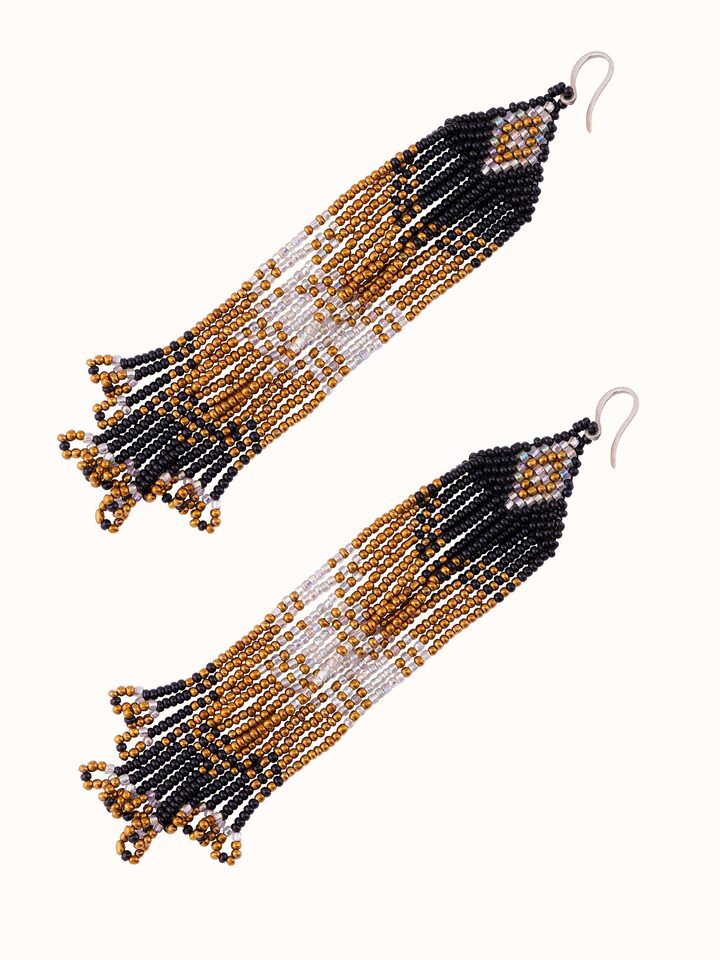 Angled view of Silver Smithing Drop Earrings showcasing detailed craftsmanship.