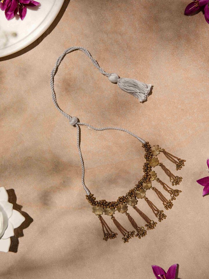 Side view of Dhokra Collar Necklace highlighting the unique collar design and intricate metal detailing.
