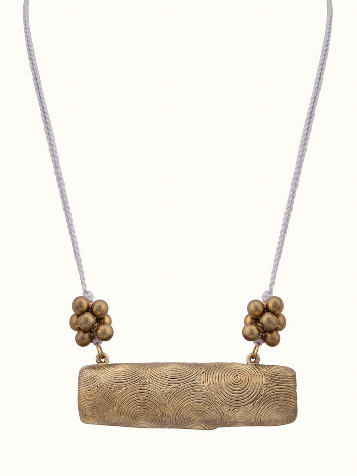 Front view of Dhokra long necklace highlighting intricate tribal designs.