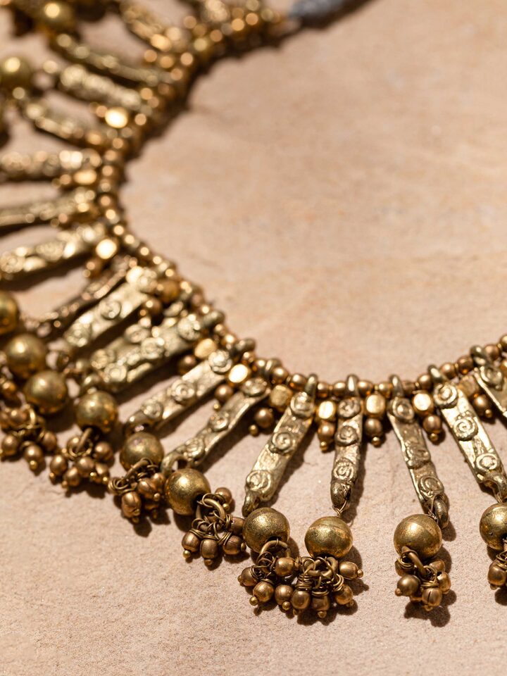 Detail view of Dhokra Choker highlighting the stone setting and metalwork detail