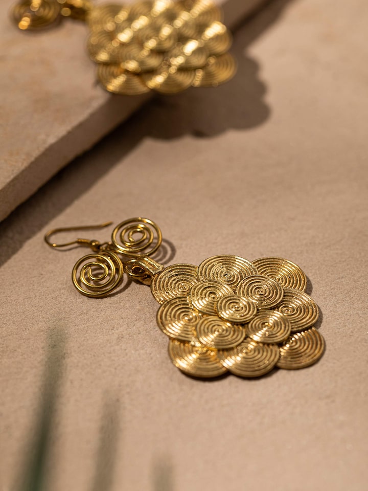Detailed view of Dhokra Drop Earrings from a distance showcasing their intricate design and finish.