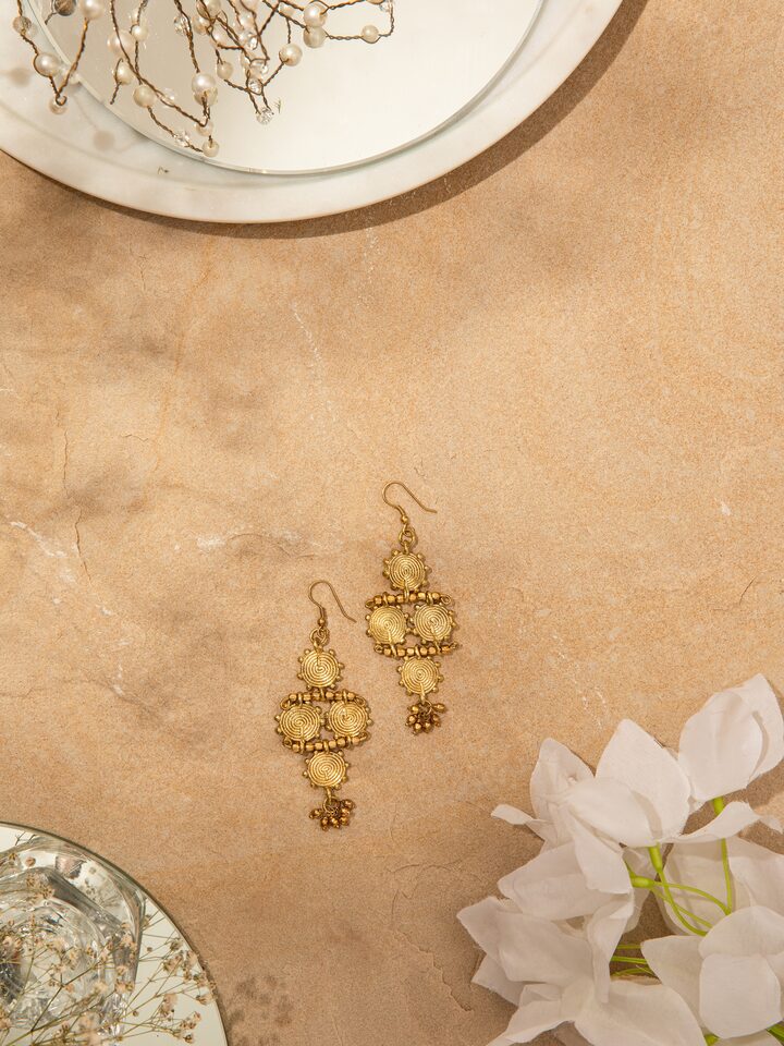 Close-up view of Dhokra Drop Earrings featuring the fine metalwork and traditional Dhokra design elements.