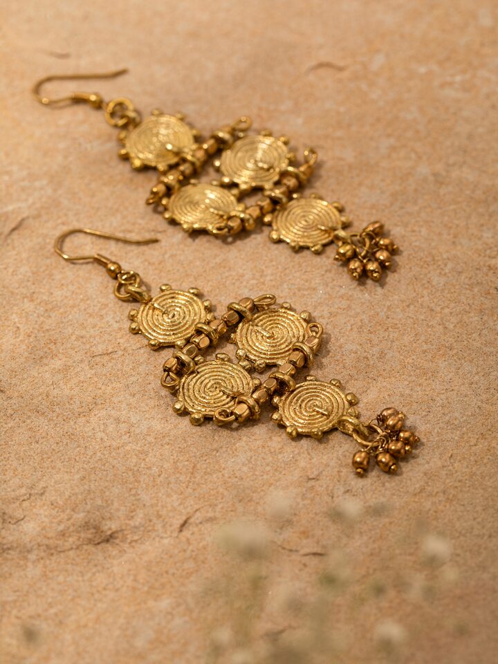 Overhead view of Dhokra Drop Earrings featuring intricate Dhokra metalwork and elegant drop style.