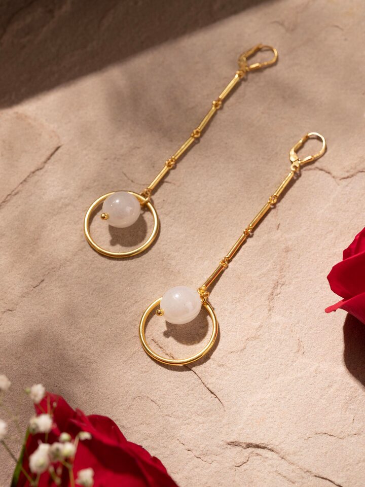 Side view of Silver Flame Glass Drop Earrings emphasizing drop design and vibrant glass colors.