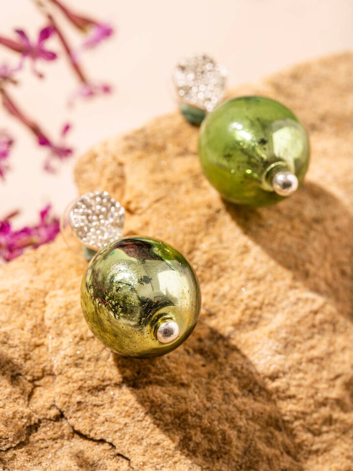 Detail view of Silver Flame Glass Drop Earrings highlighting the stone setting and metalwork detail