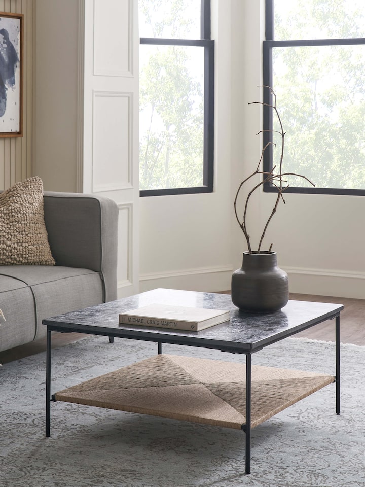 Side view of Jute & Marble coffee table highlighting its smooth marble surface and sturdy jute base with a modern design.