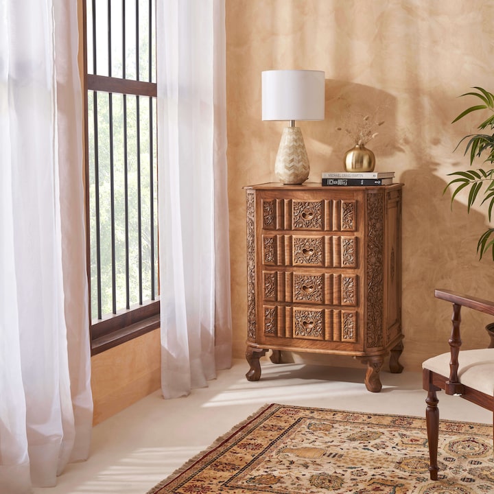 Side view of carved walnut drawer chest, highlighting the elegant design and craftsmanship