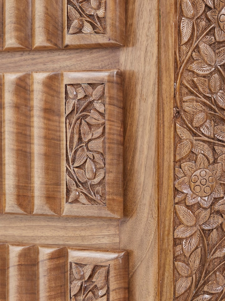 Drawer open view of carved walnut drawer chest, displaying ample storage space