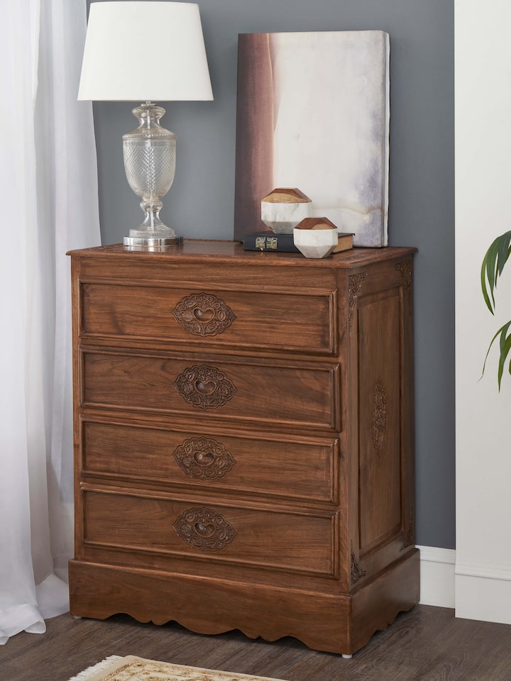 Side view of Carved Walnut Wood Drawer Chest, highlighting the detailed carvings and wood finish