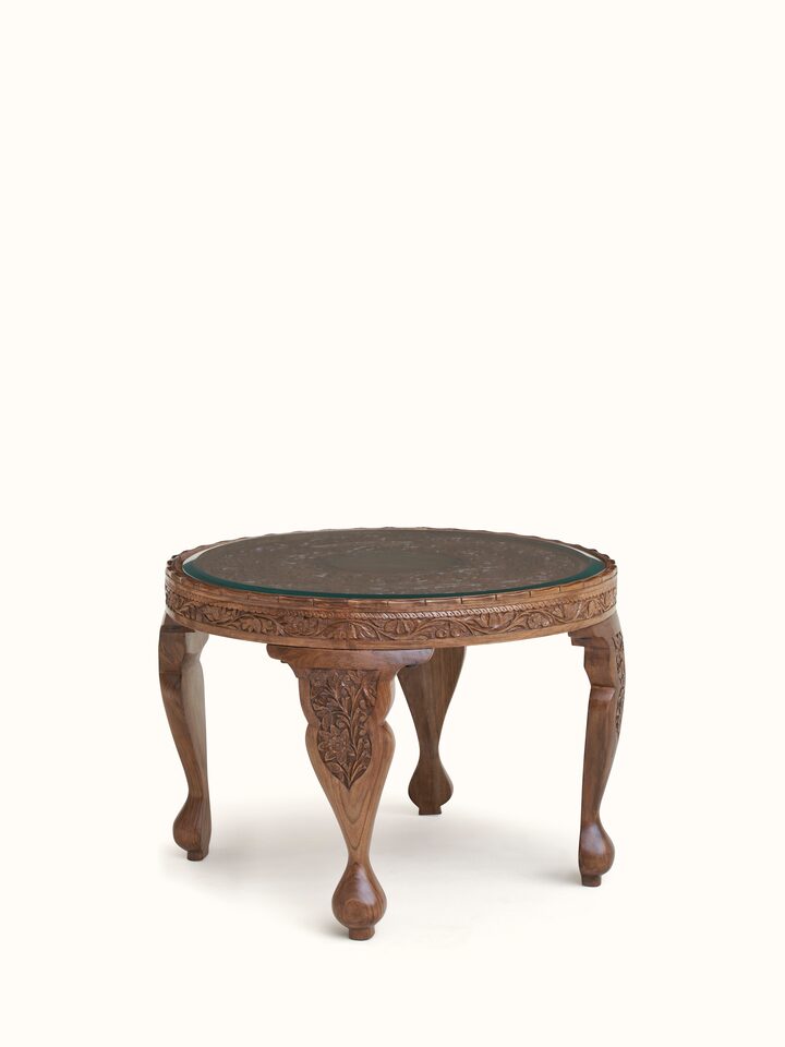 Close-up view of Carved Walnut Wood Round Coffee Table with Glass Top highlighting the inlay work and craftsmanship detail