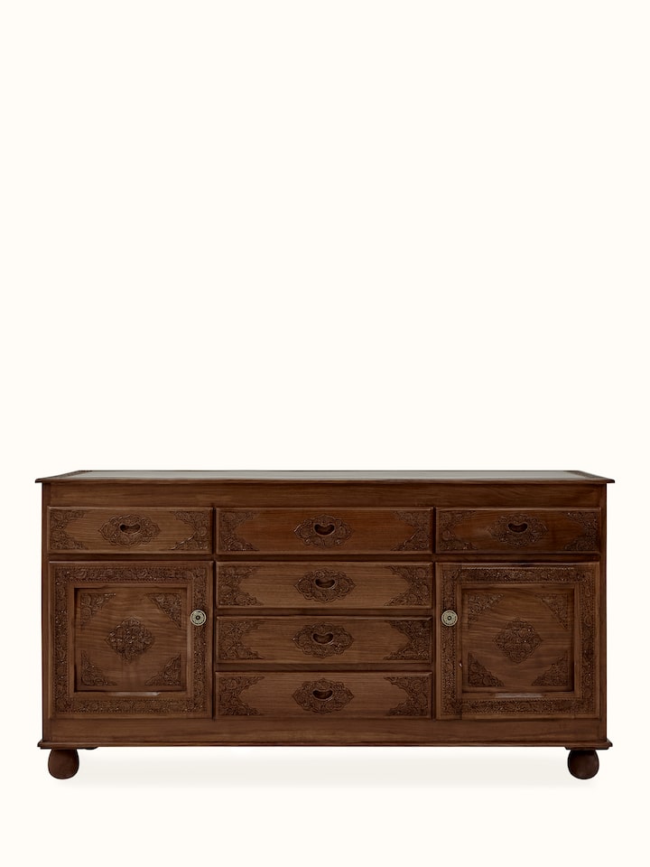 Front view of natural finish carved walnut wood sideboard with five drawers, showcasing its elegant design and detailed carvings.