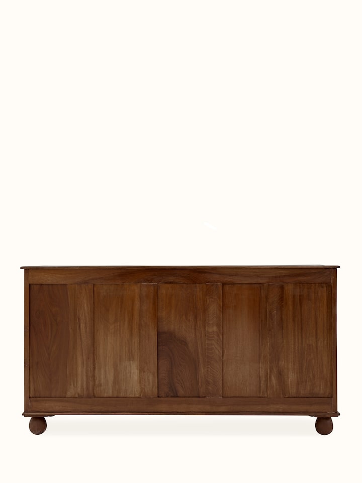Full view of the walnut sideboard with five drawers, emphasizing the natural finish and decorative carvings.