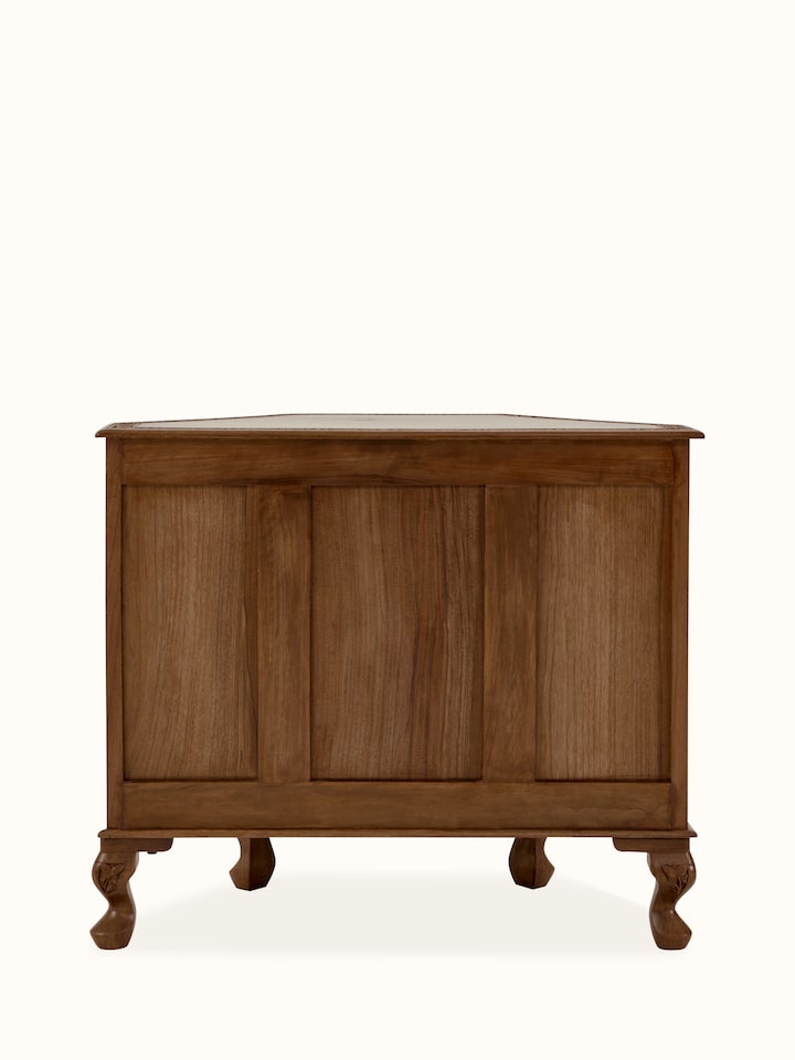 Close-up of the walnut wood grain and carved details on the sideboard, emphasizing its natural finish