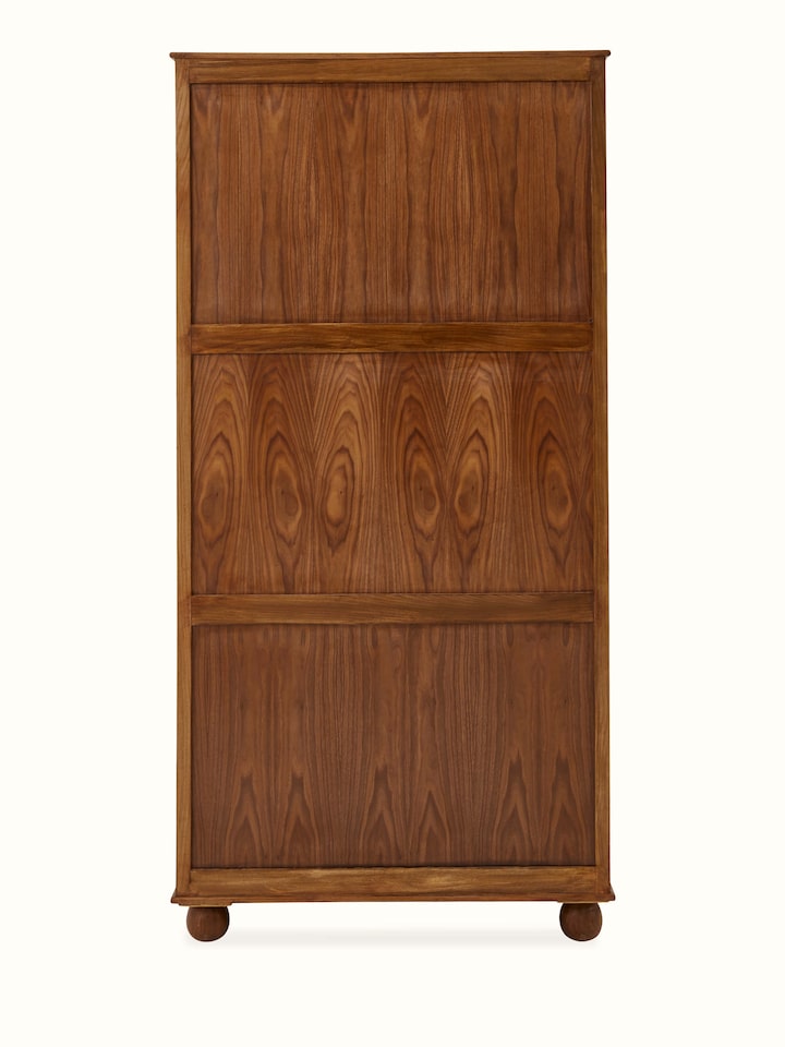 Side view of carved walnut wood wardrobe, highlighting the smooth finish and elegant design