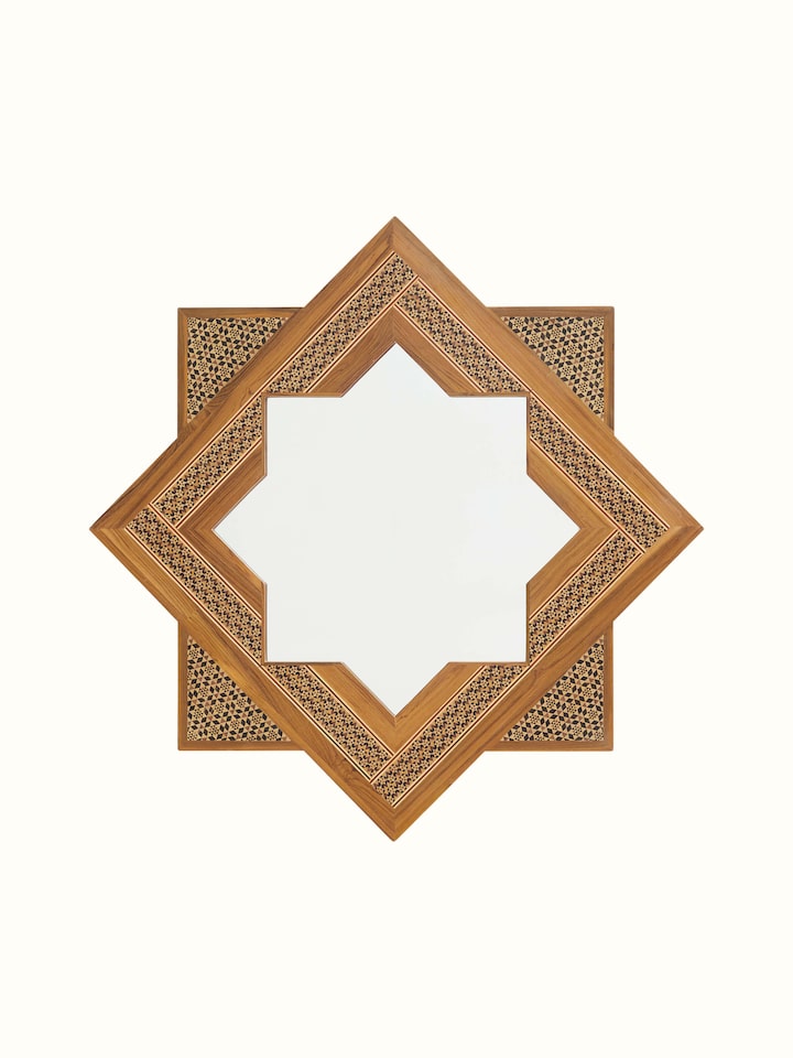 Front view of the star-shaped teak wood marquetry wall mirror, highlighting its intricate marquetry work and star design.