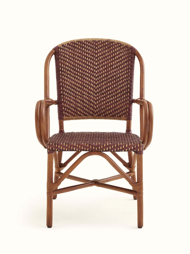 Front view of the cane patio chair, showcasing its elegant and durable design