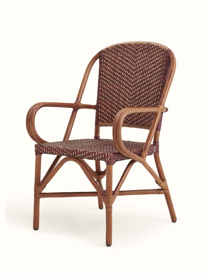 Close-up of the cane work on the patio chair, showing the detailed weaving and craftsmanship