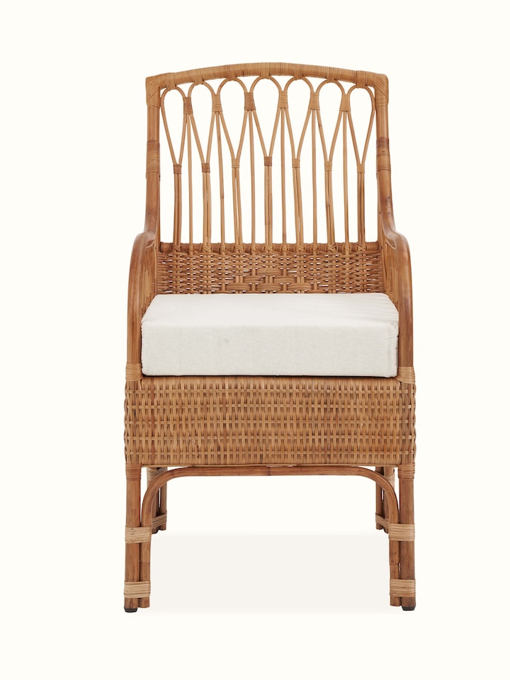Front view of the upholstered cane study chair, highlighting the elegant design and comfortable upholstery.