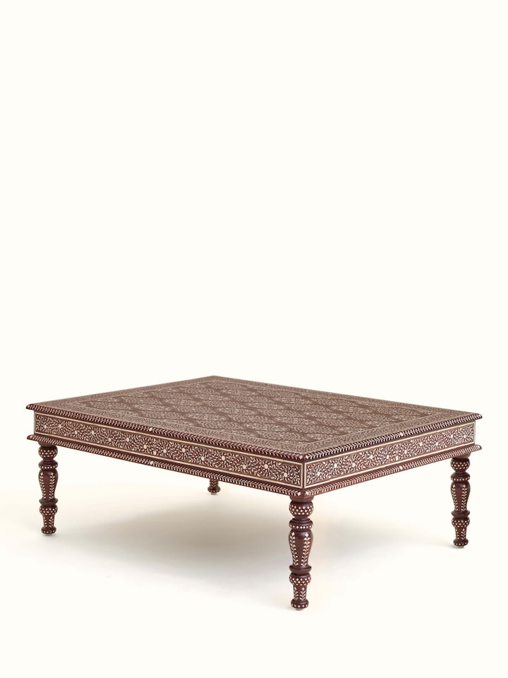 Angled view of Bone Inlay Sheesham Wood Coffee Table showing the stunning combination of bone inlay and natural wood texture.