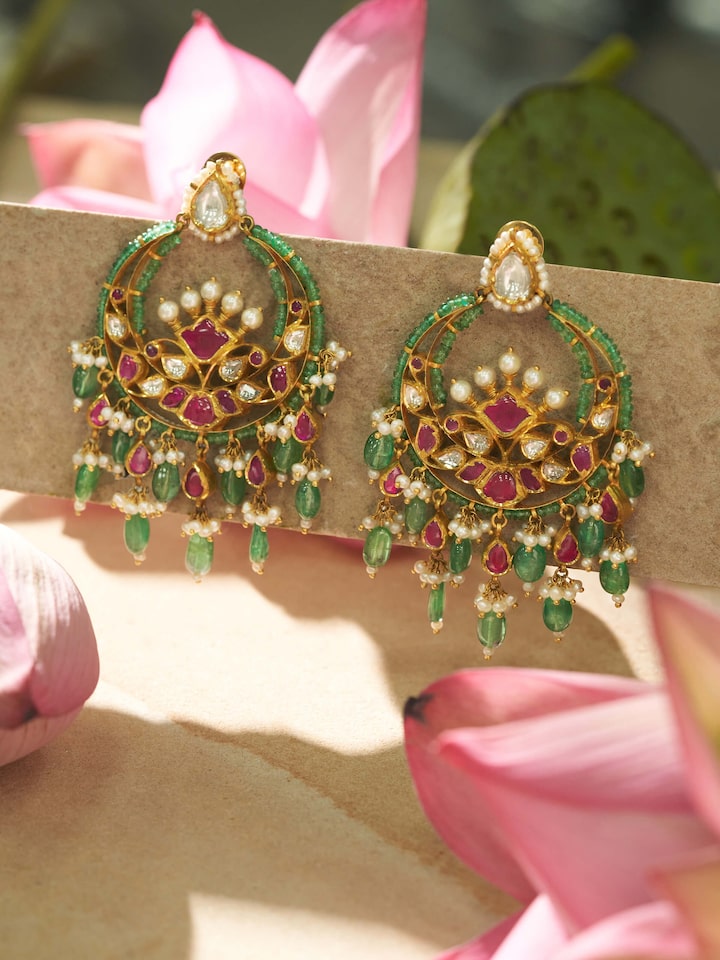 Side view of Jadau 18 Karat Gold Chandbalis highlighting the elegant curve and intricate detailing.