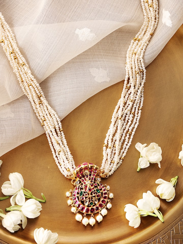 Kundala Velai 22 karat gold collar necklace displayed from a different angle to show its luxurious design.