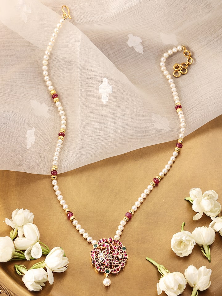 Overhead view of Kundala Velai 22 Karat Gold Collar Necklace emphasizing the detailed goldwork and full design.