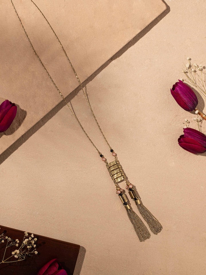 Side view of Handcrafted Long Necklace highlighting the elegant profile and unique design.