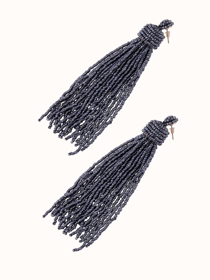 Angled view of Handcrafted Drop Earrings displaying their stylish and artistic features.