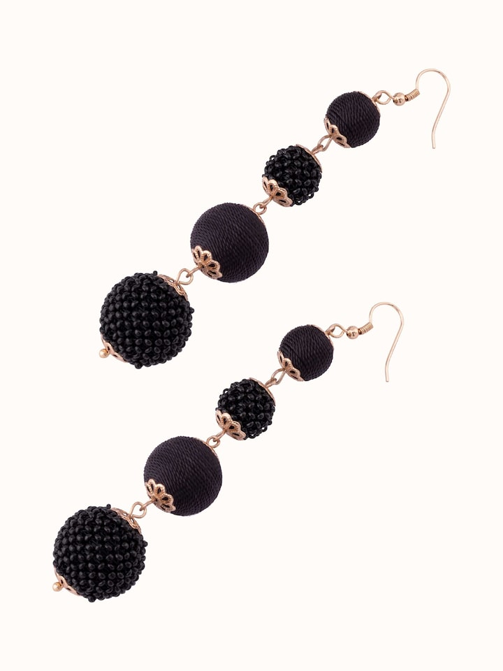 Angled view of Handcrafted Drop Earrings emphasizing the unique drop effect and design.