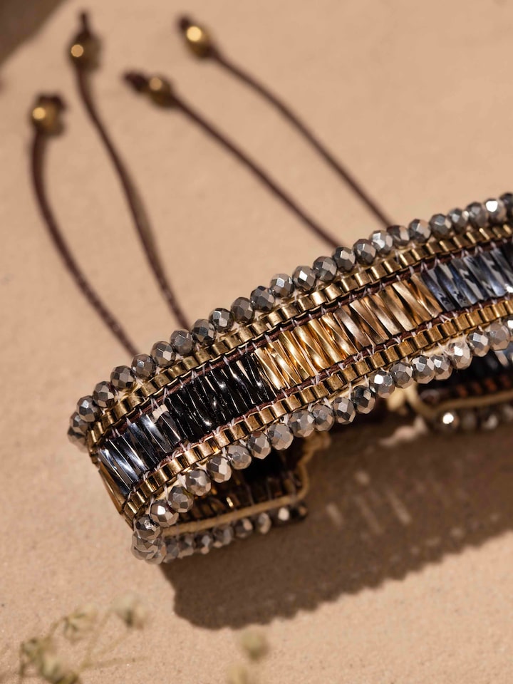 Detailed view of Handcrafted Flexible Bracelet from a distance, displaying its full design and craftsmanship.