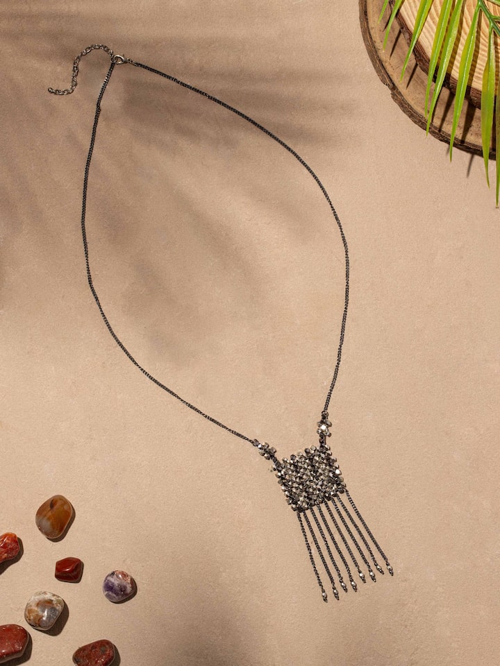 Side view of handcrafted long necklace showcasing design and texture