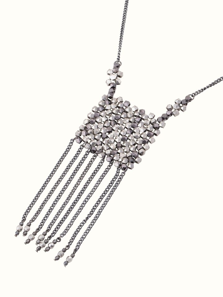 Angled view of handcrafted long necklace focusing on detailed design and craftsmanship