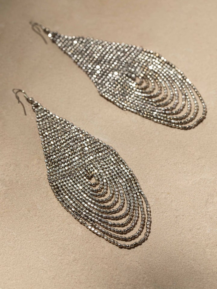Detailed close-up of Handcrafted Drop Earrings with emphasis on fine artisanal detailing.