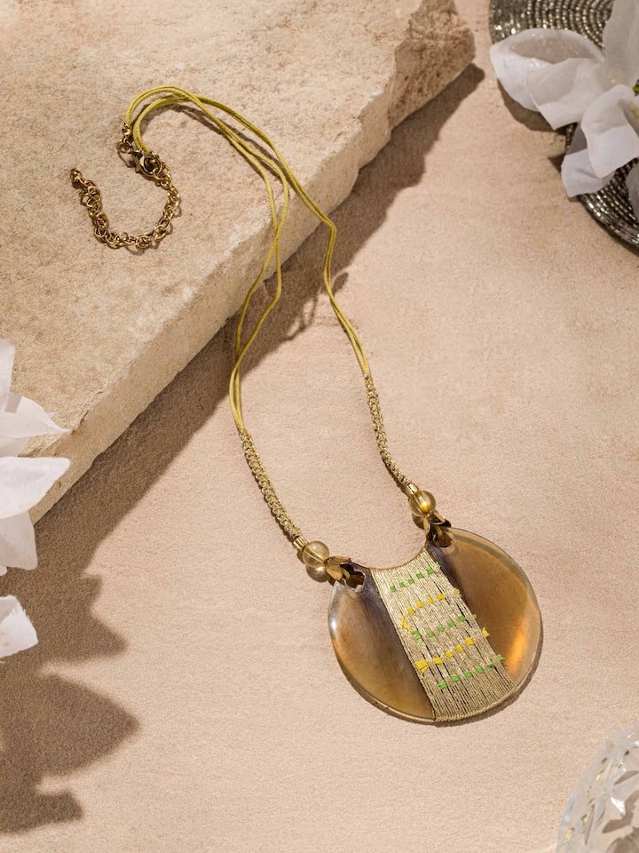 Close-up view of handcrafted long necklace highlighting its fine detailing and design