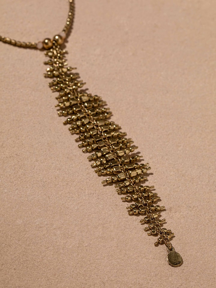 Detail view of Handcrafted Long Necklace highlighting the stone setting and metalwork detail