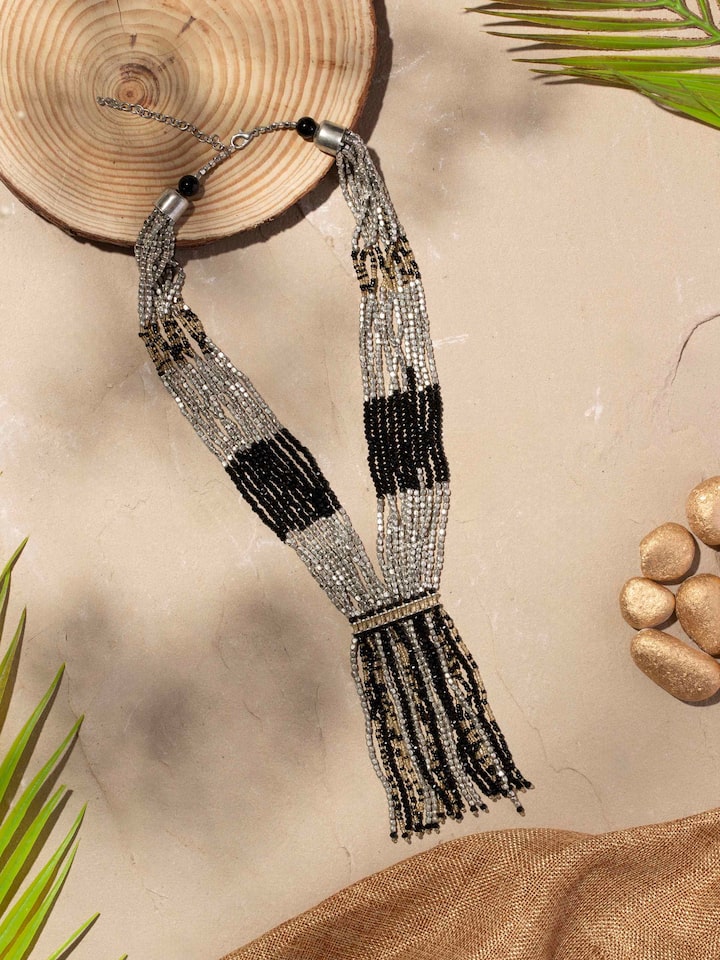 Side view of Handcrafted long necklace highlighting its intricate detailing and elegant profile
