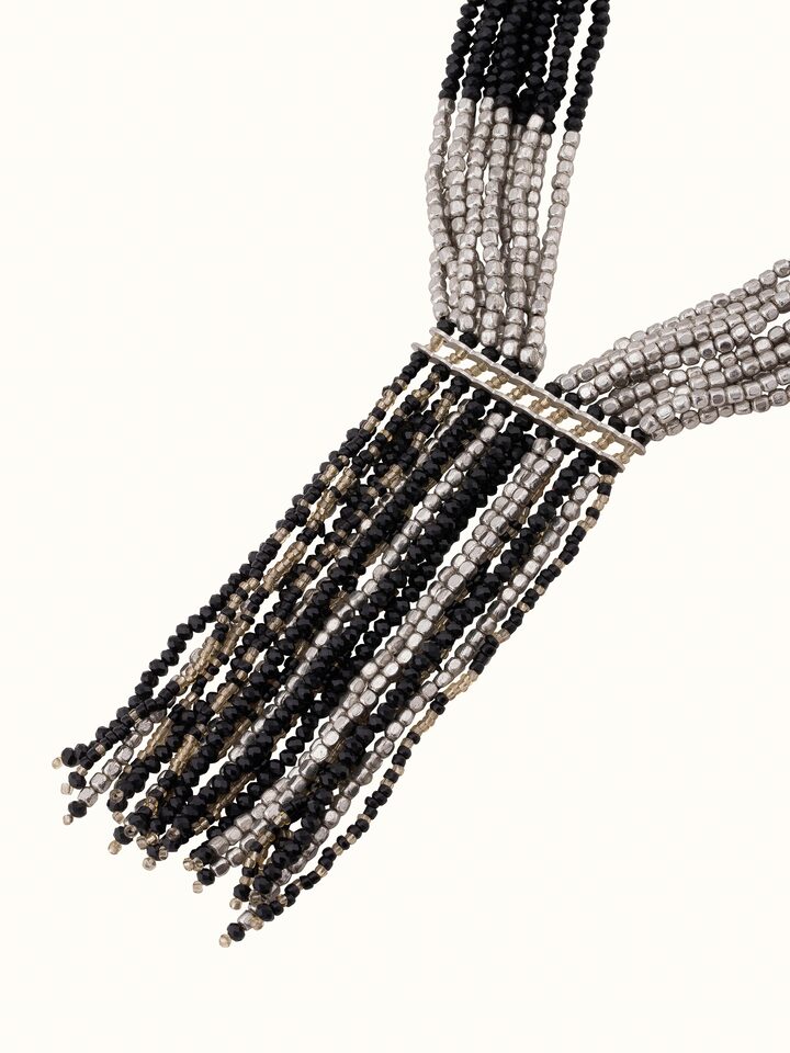 Angled view of Handcrafted long necklace showcasing its artistic design and craftsmanship
