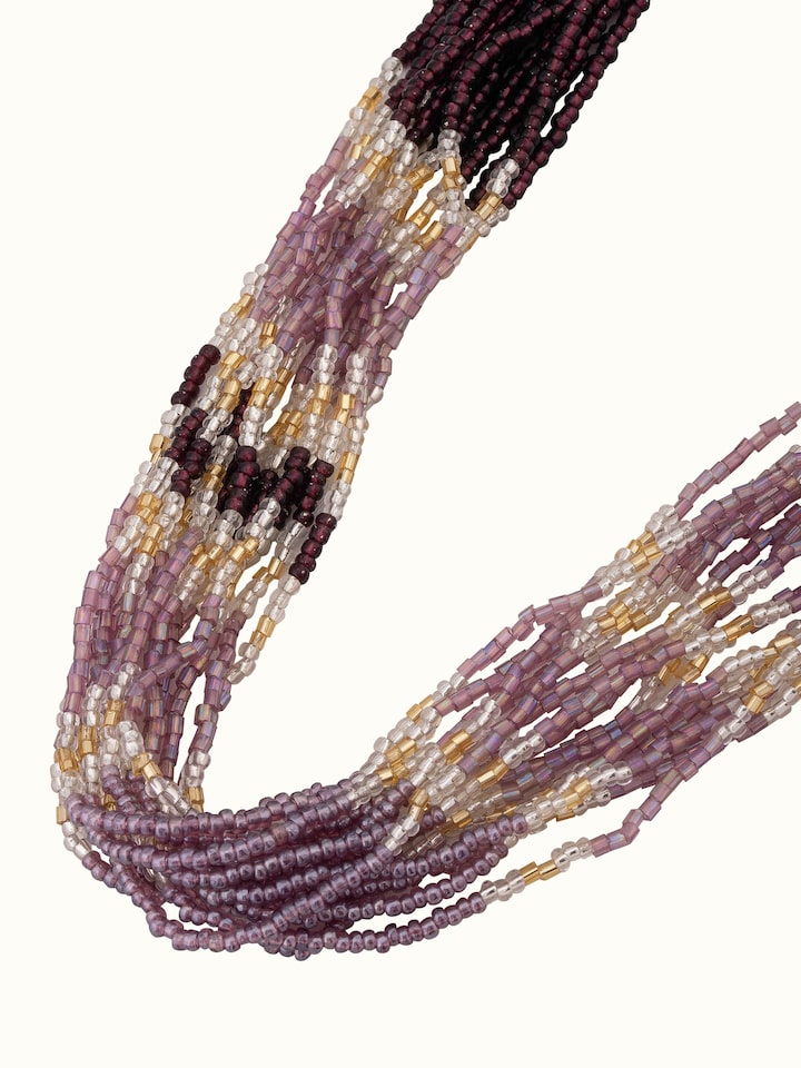 Overhead view of handcrafted long necklace showing its full length and elegant design.