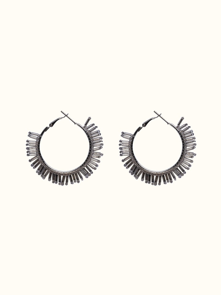 Front view of handcrafted hoop earrings featuring detailed design and artistic metalwork.