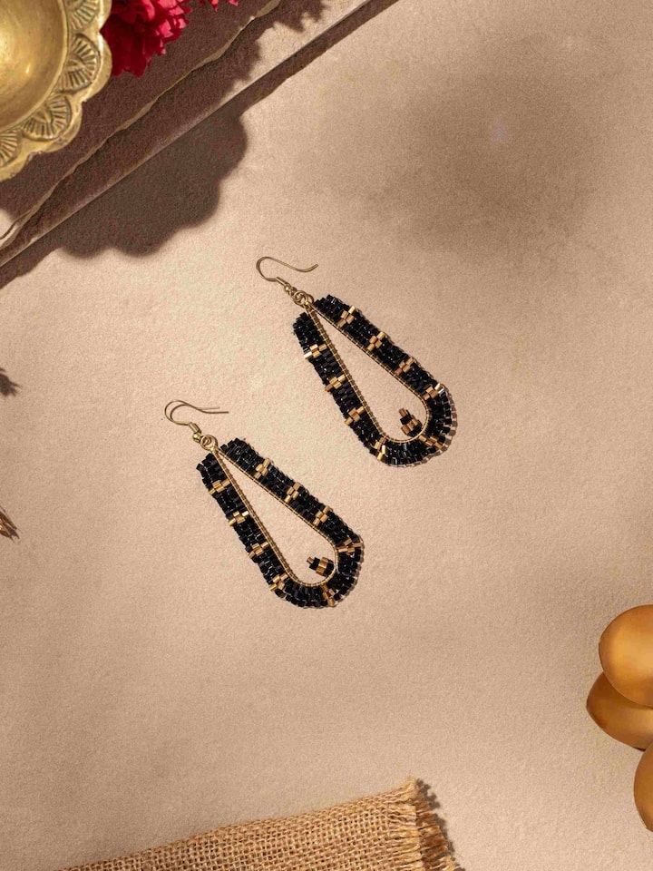 Side view of Handcrafted Drop Earrings showcasing fine detailing and artisanal work.