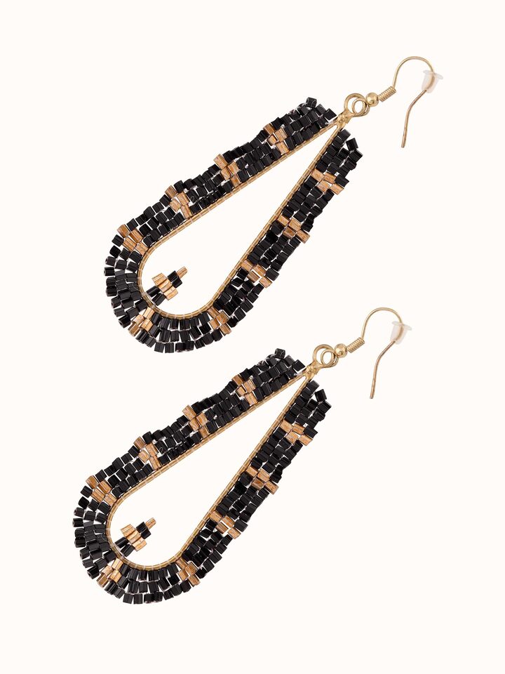 Detailed view of Handcrafted Drop Earrings focusing on artisanal craftsmanship and unique design.