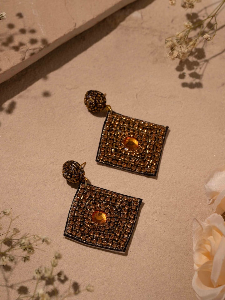 Side view of Handcrafted Drop Earrings highlighting detailed design and artisanal work.