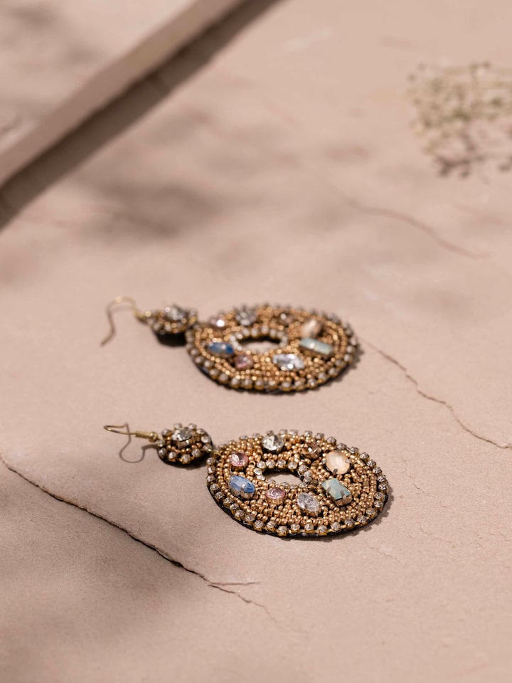 Detailed front view of handcrafted drop earrings showcasing their elegant design and color