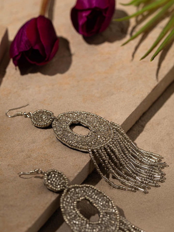 Detailed view of Handcrafted Drop Earrings focusing on the fine metalwork and design.