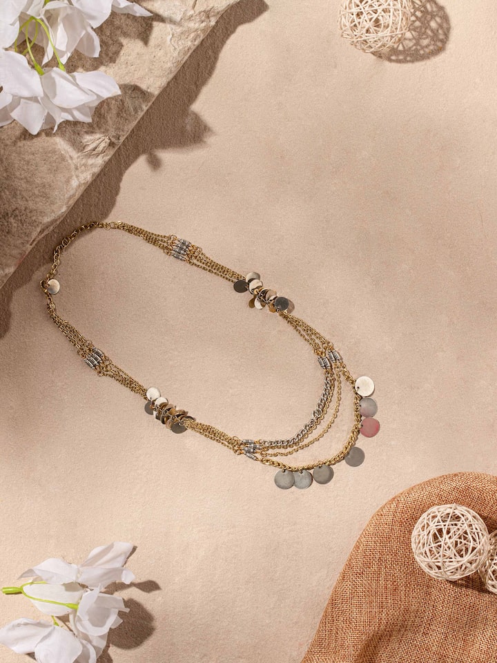 Angled view of Handcrafted Long Necklace highlighting the unique and intricate patterns.